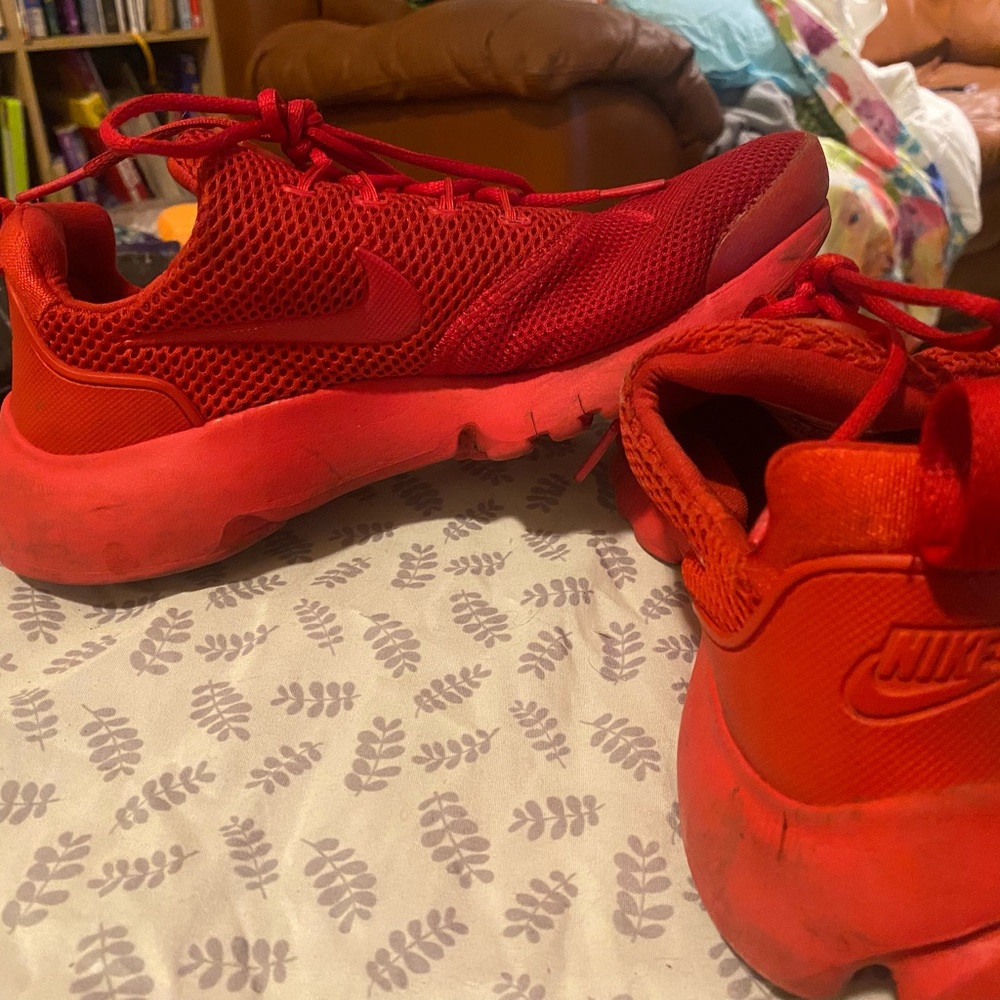 Red nike runner shoe